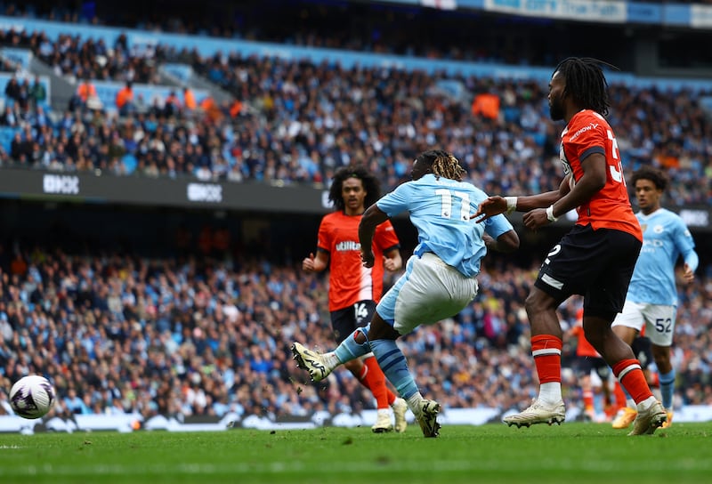 Manchester City's Jeremy Doku scores their fourth. Reuters
