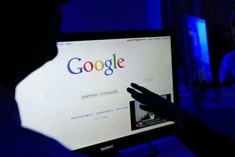 The number of online searches for the words "recession" and "economy" globally rose from a year ago via Google, which handles more than 1 billion queries a day. Emmanuel Dunand / AFP
