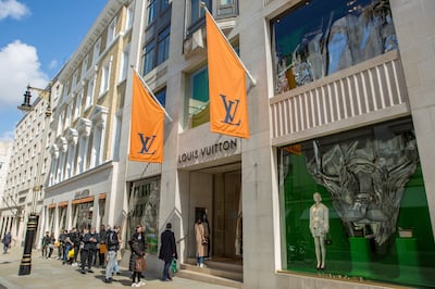 Shoppers queue outside Louis Vuitton in New Bond Street in London after Covid-19 restrictions are eased. Getty