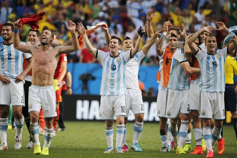 Lionel Messi and the rest of Argentina acknowledge the crowd after their win over Belgium in the 2014 World Cup quarter-finals on Saturday. Felipe Trueba / EPA / July 5, 2014