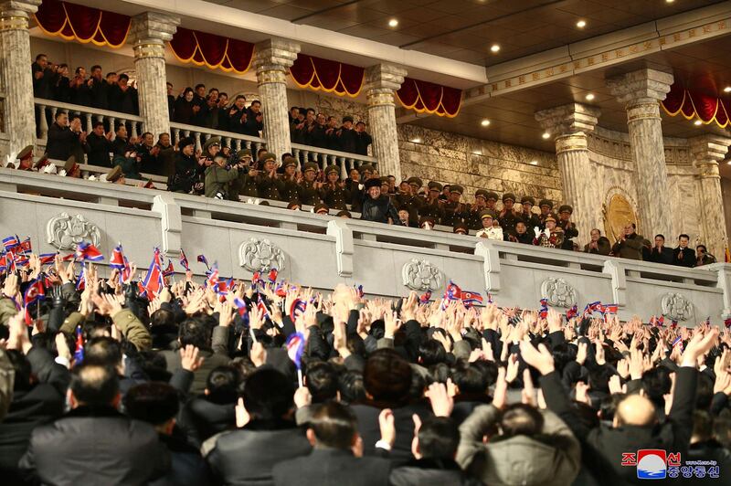 North Korean leader Kim Jong-un, centre, attends a military parade marking the ruling party congress. KCNA / AP