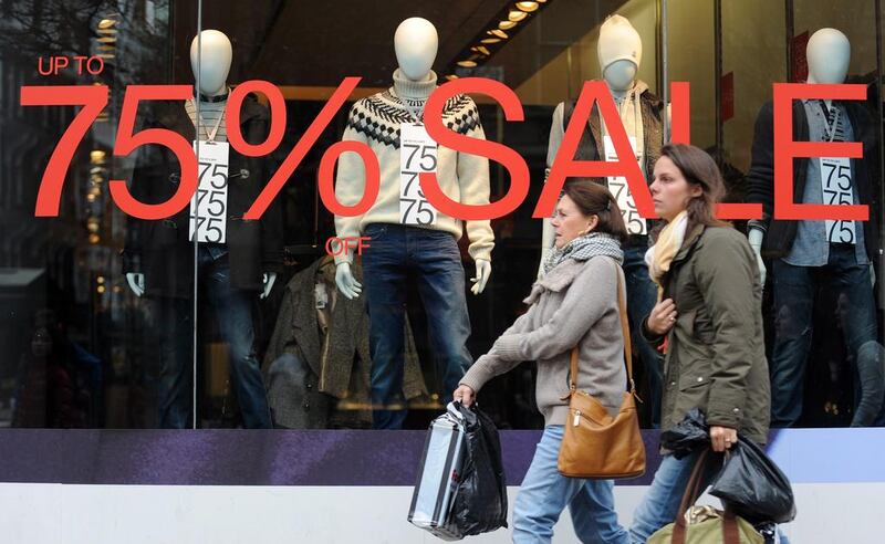 Above, a store offers a sale in central London. The UK's revenue and customs officials launched focused campaigns targeting sectors identified as worst VAT offenders. Andy Rain / EPA