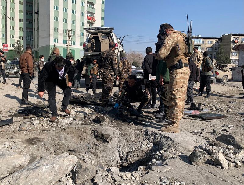 Afghan police arrive at the site of a bomb attack in Kabul on December 15, 2020. AP