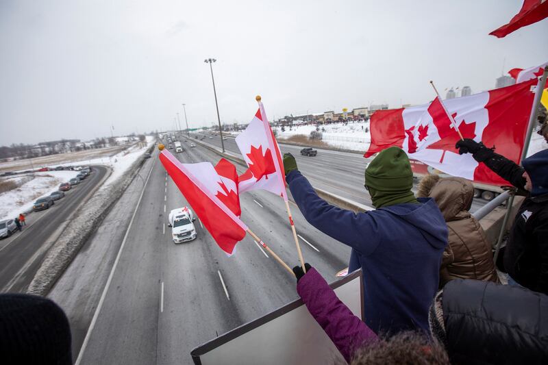 People in Toronto show their support for lorry drivers on their way to Ottawa to protest against cross-border vaccine mandates. Reuters