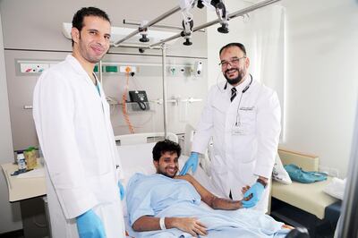 Specialist orthopaedic surgeon Dr Mohammad Ali (left) with lift engineer Flertin Baby, 33, and consultant orthopaedic surgeon Dr Hassan Badawi (right) at Rashid Hospital in Dubai. Courtesy: DHA