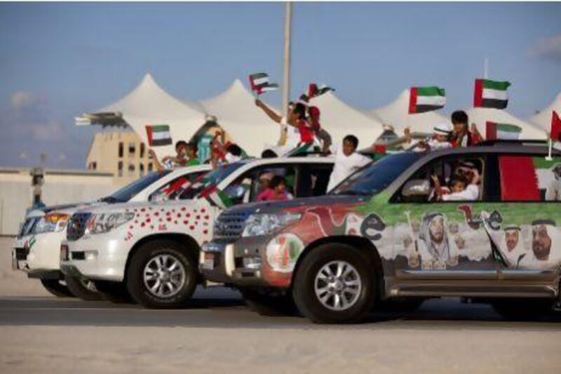 People join in celebration and show off their decorated cars during the Spirit of Union Parade at Yas Island in 2011. Silvia Razgova/The National