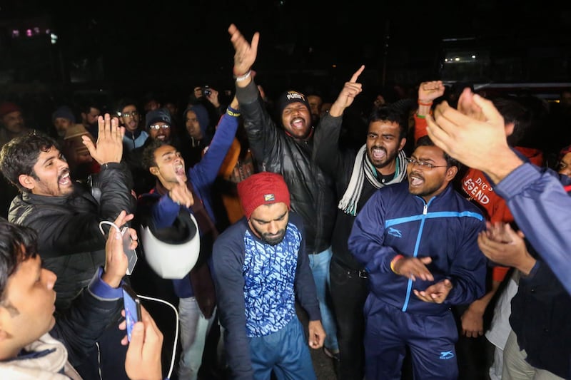 Students and supporters shout slogans outside to protest following alleged clashes between student groups at Jawaharlal Nehru University (JNU) in New Delhi on January 5, 2020. At least 23 people were hurt at a prestigious Indian university on January 5 in what police said were clashes between rival student groups. The incident at JNU is the latest in a series of violent clashes and protests at different Indian universities in the last few weeks, with many student activists and opposition demonstrating against Modi government's controversial new citizenship law. / AFP / STR
