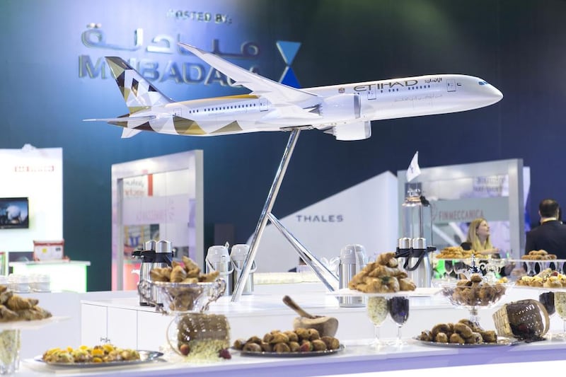 A model Etihad plane stands on a table at the Global Aerospace Summit. Reem Mohammed / The National