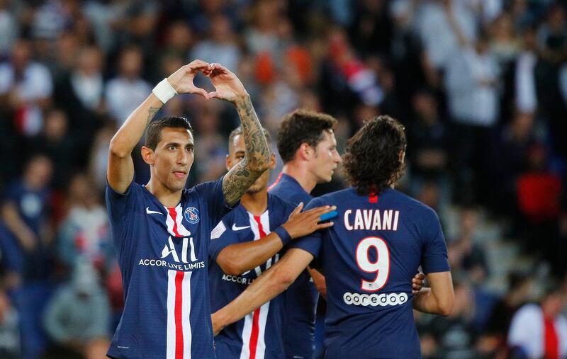 PSG's Angel Di Maria celebrates with his teammates after scoring his side's third goal. AP Photo