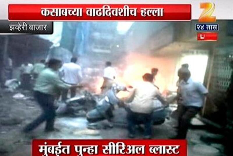 A screen grab from Indian television showing people on the streets reacting after explosions hit Mumbai today. Zee TV via Reuters TV  
