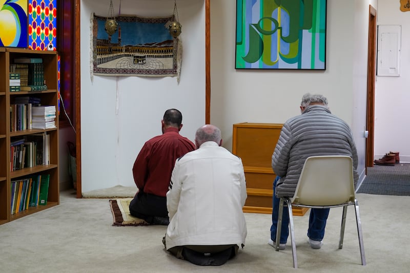 Imam Taha Tawil leads prayers at the small mosque.