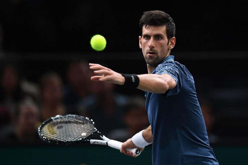 Serbia's Novak Djokovic returns the ball to Portugal's Joao Sousa during their men's singles second round match on day two of the ATP World Tour Masters 1000 - Rolex Paris Masters - indoor tennis tournament at The AccorHotels Arena in Paris, on October 30, 2018. / AFP / Anne-Christine POUJOULAT            
