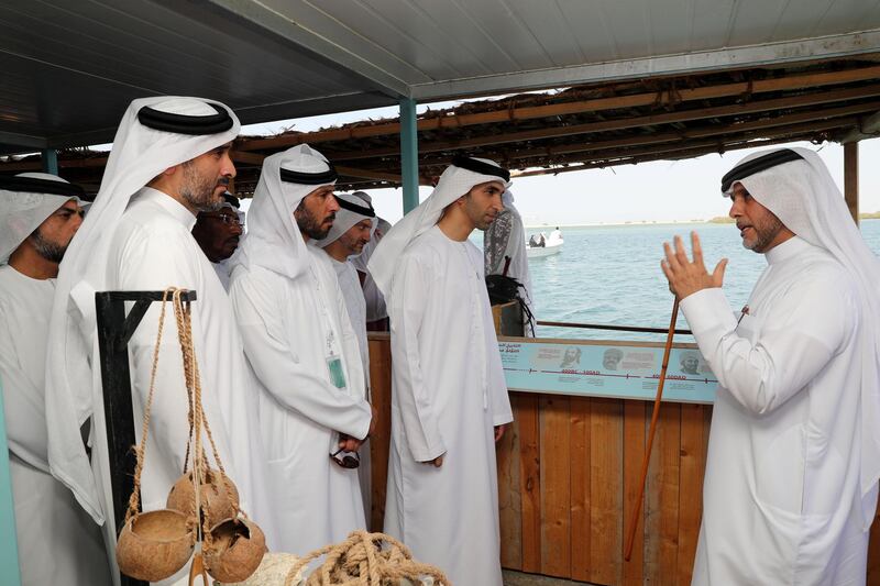 Ras Al Khaimah, United Arab Emirates - October 13, 2018: Abdullah Al Suwaidi (R) gives a guided tour of the Al Suwaidi Pearl Farm to His Excellency Dr Thani bin Ahmed Al Zeyoudi (M), Minister of Climate Change and Environment Directors of municipalities and environment agencies in the UAE. The launch of the ecotourism microsite and app coincides with the National Ecotourism Project, a multiphased initiative that will position the UAE as a global ecotourism hub. Saturday, October 13th, 2018 in Al Rams, Ras Al Khaimah. Chris Whiteoak / The National