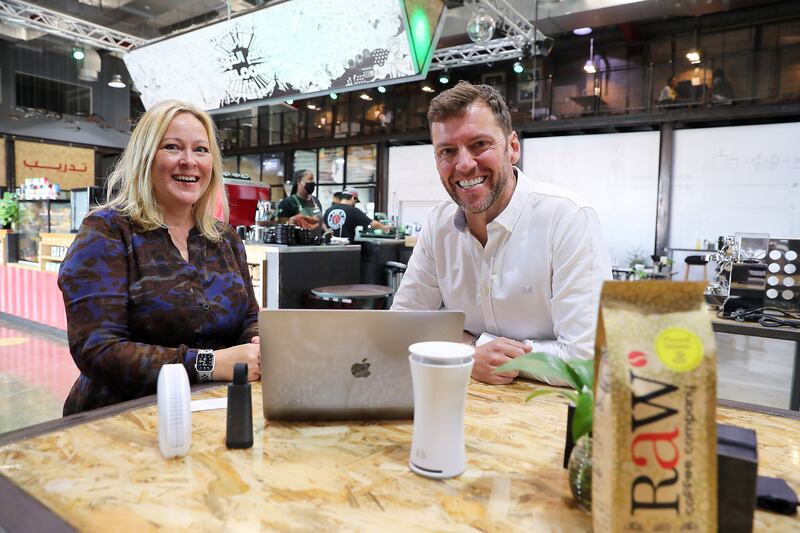 Helen Barrett, left, partner at CBD Corporate Services, and Chris Leighton, AirZones' co-founder, at the RAW Coffee Company in Al Quoz, in Dubai. Pawan Singh / The National