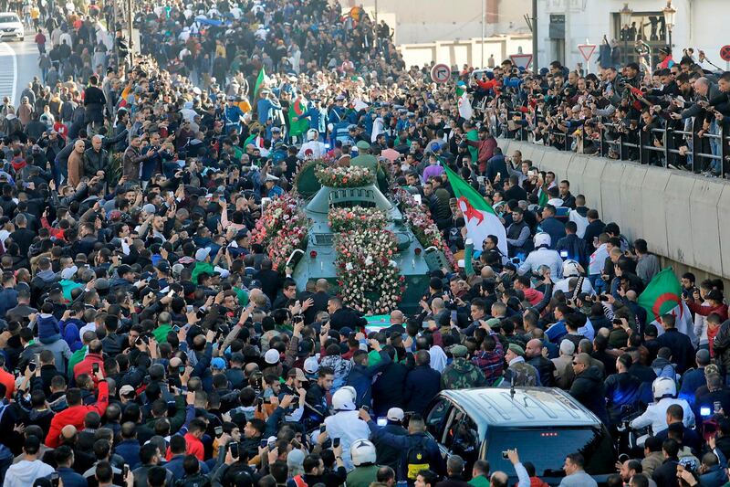 Thousands of Algerians gathered on Wednesday for the funeral procession of the country’s powerful army chief. AFP