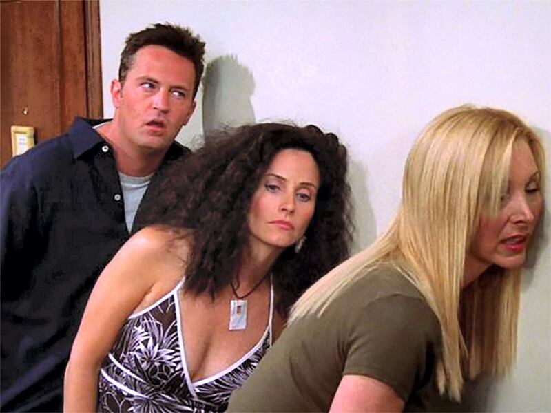 Chandler, Monica and Phoebe listening in on the answers