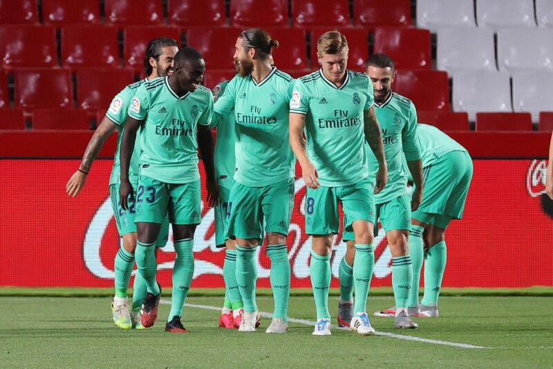 Real Madrid's Ferland Mendy (L) celebrates with teammates after scoring the opening goal. EPA