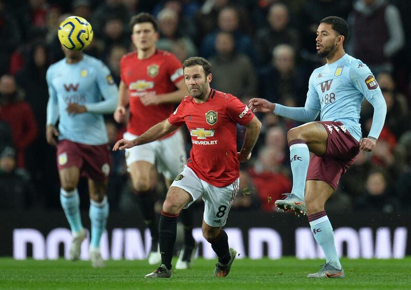 Manchester United's Juan Mata (L) and Aston Villa's Douglas Luiz in action. EPA