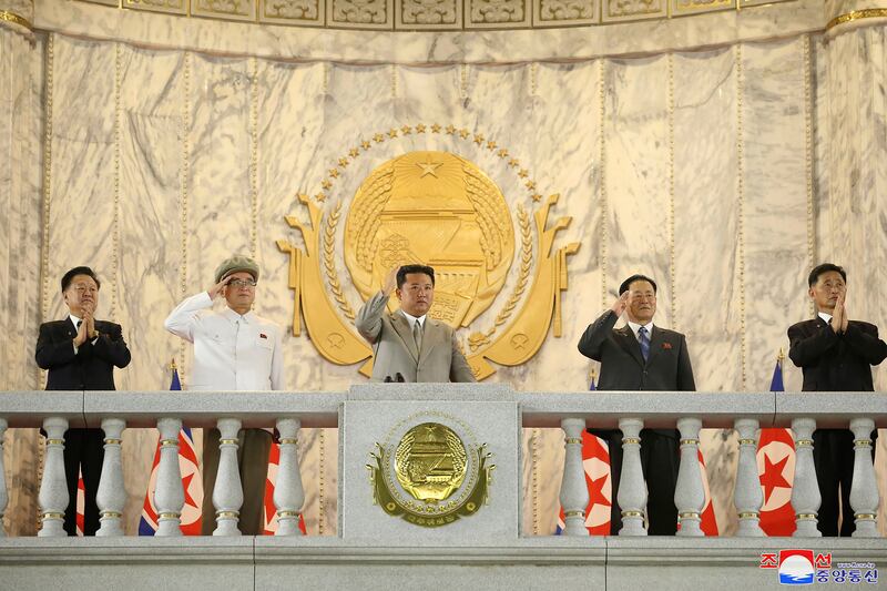 Mr Kim waves to troops and spectators during the anniversary celebration at Kim Il-sung Square in Pyongyang.  AP
