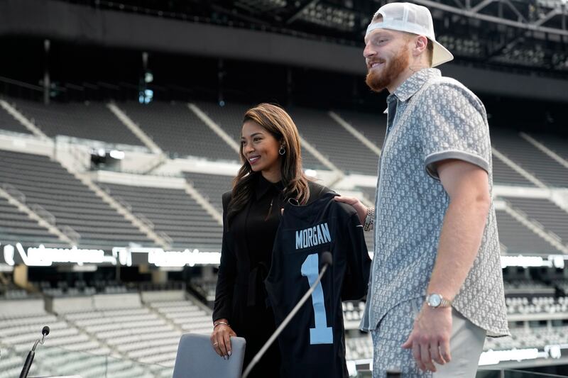 Sandra Douglass Morgan poses with Las Vegas Raiders defensive end Maxx Crosby at a news conference announcing her as president of the Raiders NFL American football team. AP