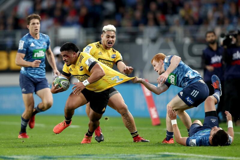 Asafo Aumua of the Hurricanes is tackled during the Super Rugby match against the Blues. Getty