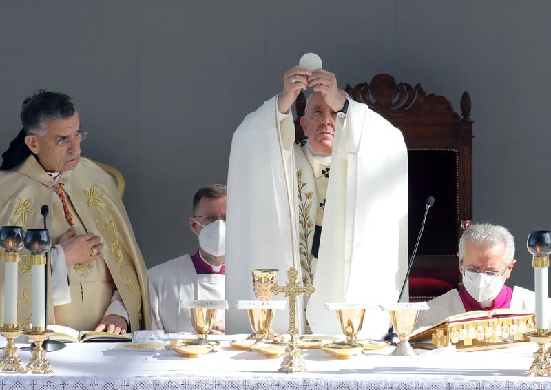 Pope Francis holds up the Eucharist during mass at the GSP Stadium in Nicosia, Cyprus, on Friday morning, drawing thousands of Catholics.  EPA / KATIA CHRISTODOULOU