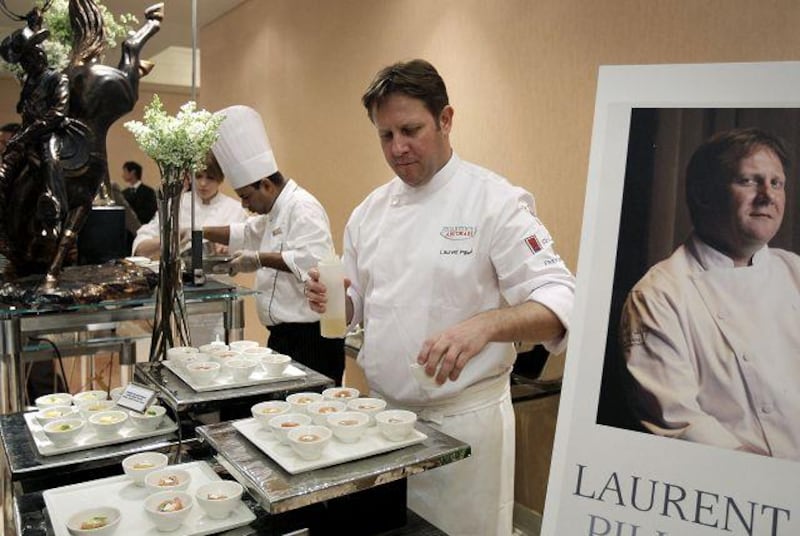 The chef Laurent Pillard prepares appetisers for a gala dinner at Al Raha Beach Hotel.