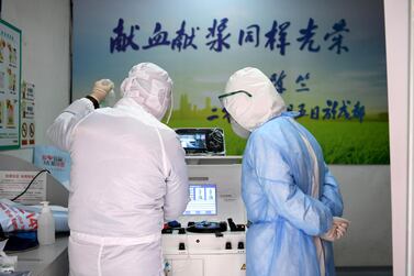 Medical workers in protective suits inspect equipment at a blood donation room of the Renmin Hospital of Wuhan University in Wuhan, the epicentre of the novel coronavirus outbreak, in Hubei province, China February 14, 2020. Reuters