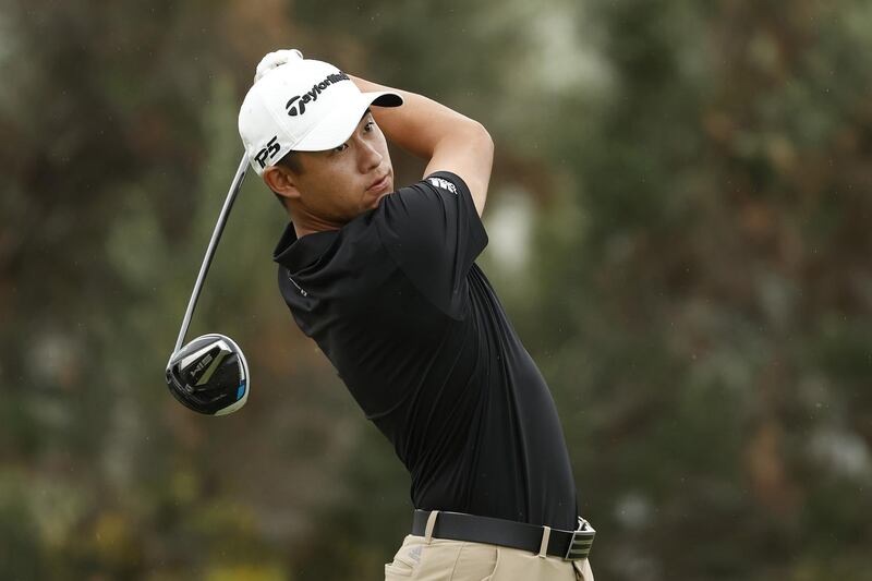 Collin Morikawa plays his shot from the first tee during the final round of the Sony Open in Hawaii. AFP
