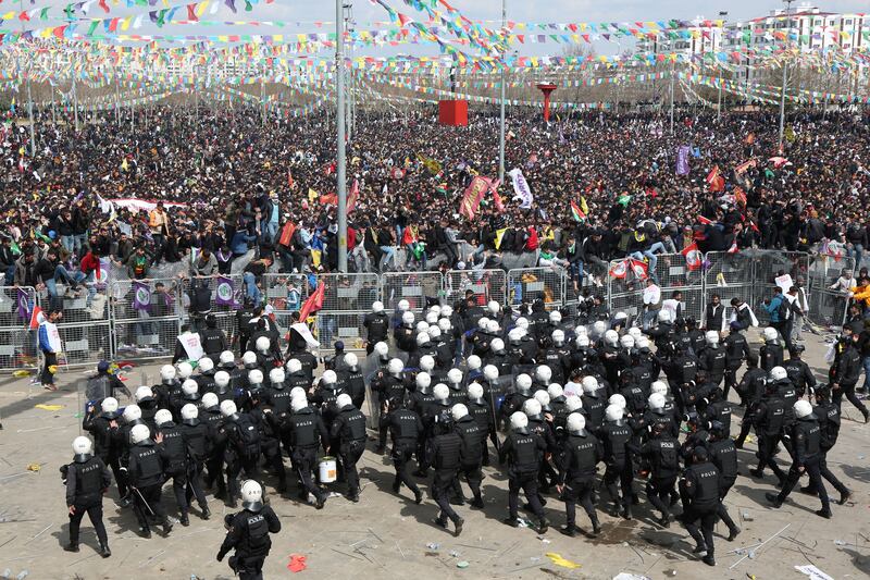 Riot police take position on security barriers during a gathering of Kurds to celebrate Nowruz, which marks the arrival of spring, in Diyarbakir, Turkey. Reuters