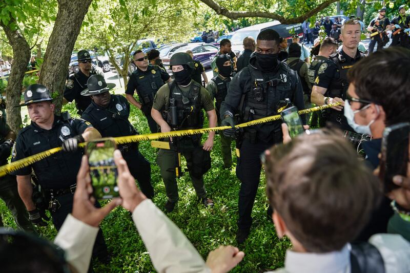 Pro-Palestinian activists confront police officers during a demonstration at Emory University, in Atlanta, Georgia. AFP