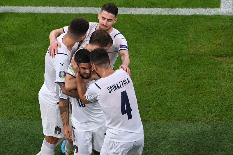 Italy forward Lorenzo Insigne (C) celebrates scoring their second goal against Belgium.