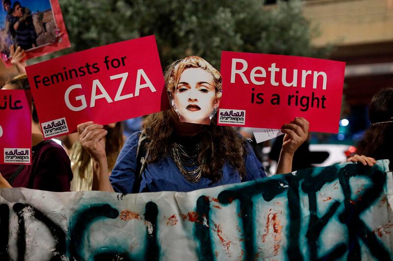 A demonstrator wearing a mask, bearing the likeness of American singer Madonna, during a protest calling for a boycott of the ongoing 2019 Eurovision Song Contest, in the Israeli coastal city of Tel Aviv.   AFP