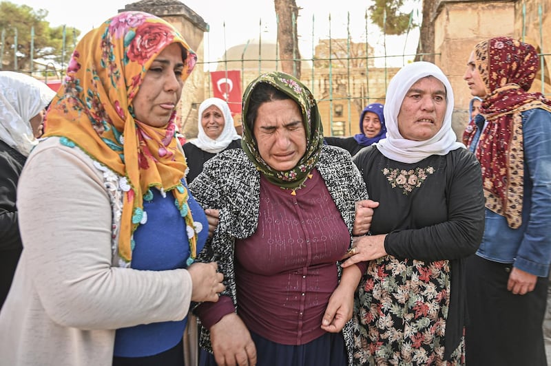 Relatives mourn during the funeral ceremony of Ismail Taskin who was killed in a mortar attack a day earlier in Suruc near northern Syria border, during funeral ceremony in Suruc. Ten Turkish civilians were killed in cross-border shelling on Friday, while four of Turkey's soldiers died as Ankara pressed on with its offensive against Kurdish militants in Syria.
Eight civilians were killed and 35 injured in one mortar strike in Nusaybin in Mardin province, according to the governor's office cited by local media. AFP