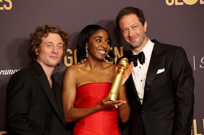 Jeremy Allen White, Ayo Edebiri, and Ebon Moss-Bachrach with the award for Best Television Series Musical or Comedy for The Bear. Reuters