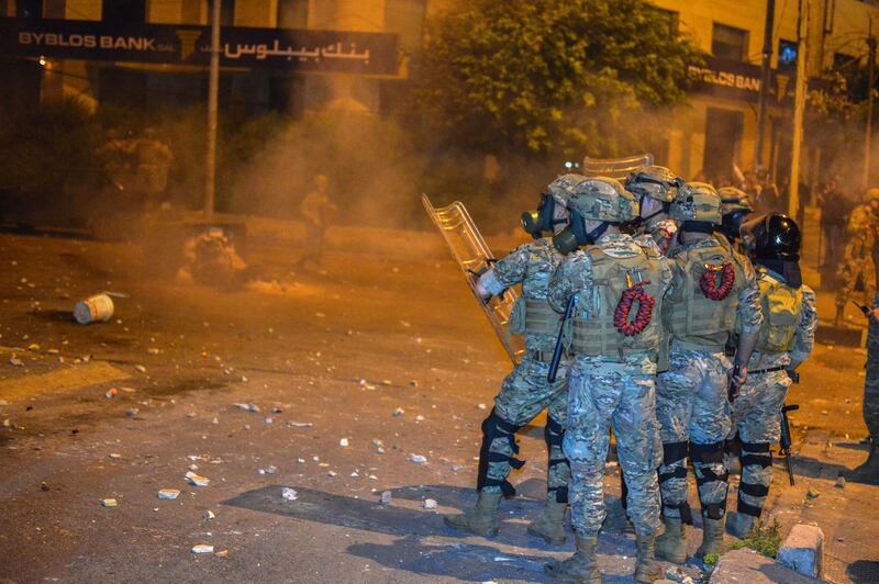 epa08393063 Lebanese army soldiers during clashes with demonstrators in northern city of Tripoli, Lebanon, 29 April 2020 ( Issued on 30 April 2020). According to media reports, the Lebanese Lira has slumped since October as Lebanon has sunk deeper into  financial crisis that caused a major hike in prices, fueled unrest and locked depositors out of their US dollar savings.  EPA/ESPER MELHEM