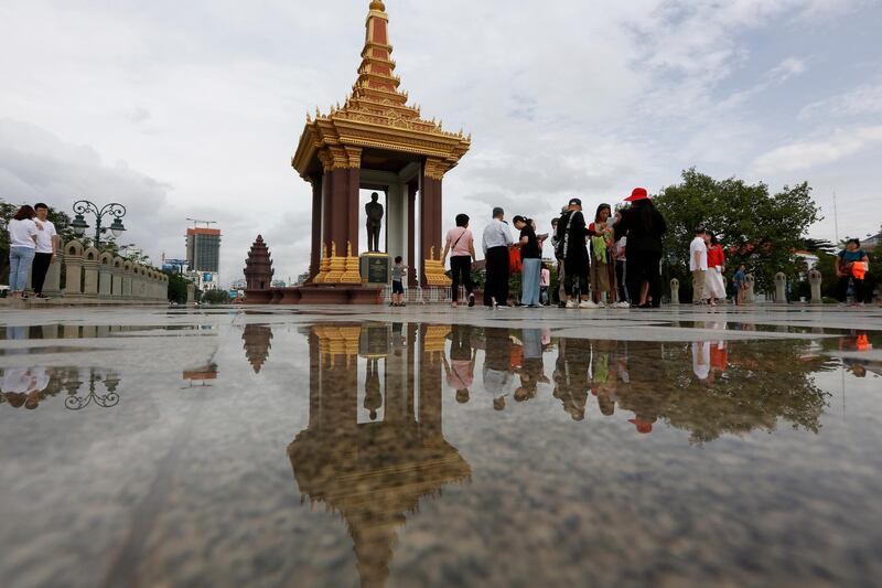Tourists visit at the late King Norodom Sihanouk statue in Phnom Penh, Cambodia. Kith Serey / EPA