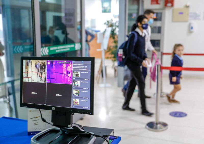 Abu Dhabi, United Arab Emirates, February 16, 2021.  Pupils return to school on Sunday at British School Al Khubairat.  Security keep a watchful eye on the thermal monitors at the entrace of the school.
Victor Besa/The National
Reporter:  Haneen Dajani
Section:  NA