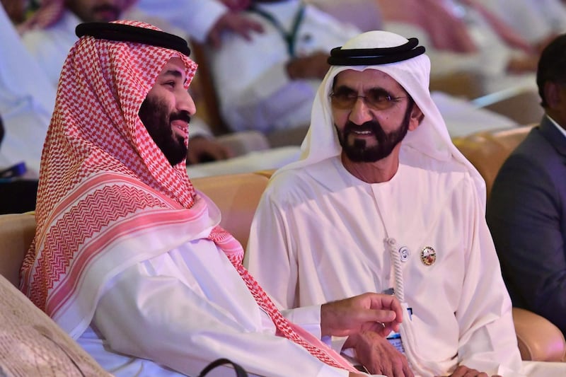 Saudi Crown Prince Mohammed bin Salman (L) talks to Vice President and Prime Minister of the United Arab Emirates Sheikh Mohammed bin Rashid Al Maktoum during the Future Investment Initiative FII conference in the Saudi capital Riyadh on October 24, 2018. The summit, nicknamed "Davos in the desert", has been overshadowed by growing global outrage over the murder of a Saudi journalist inside the kingdom's consulate in Istanbul. / AFP / GIUSEPPE CACACE
