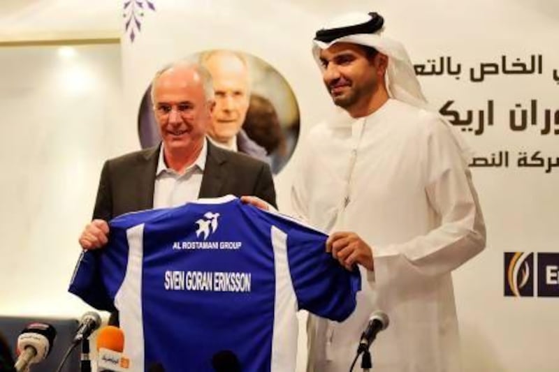 Sven-Goran Eriksson is presented a football jersey by Ahmed Hashim Khoori, the club vice president. Charles Crowell for The National