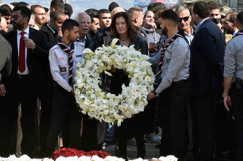 US Ambassador to Lebanon Dorothy Shea, centre, lays a wreath on Rafik Hariri's grave. EPA 