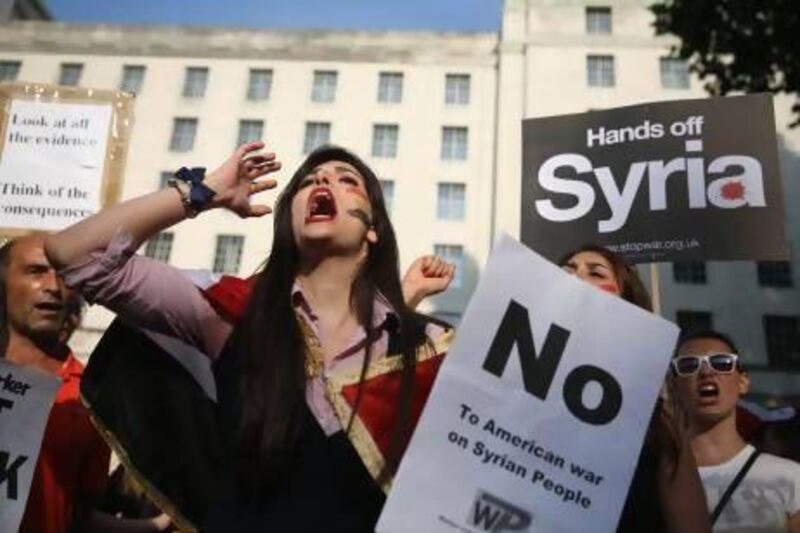 Protesters gather on Whitehall outside Downing Street to campaign for no international military intervention in the ongoing conflict in Syria.