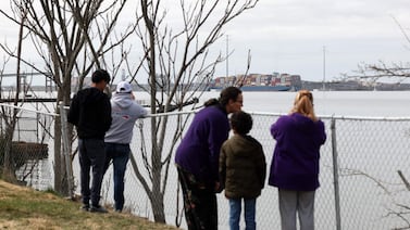 Residents look on after a cargo ship ran into and brought down the Francis Scott Key Bridge in Baltimore, Maryland. Getty Images / AFP