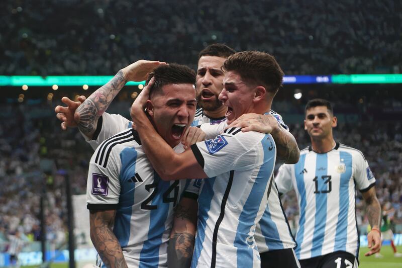 Enzo Fernandez of Argentina celebrates with teammates after scoring their team's second goal against Mexico during the Wolrd Cup group-stage match at Lusail Stadium on November 26, 2022. Getty