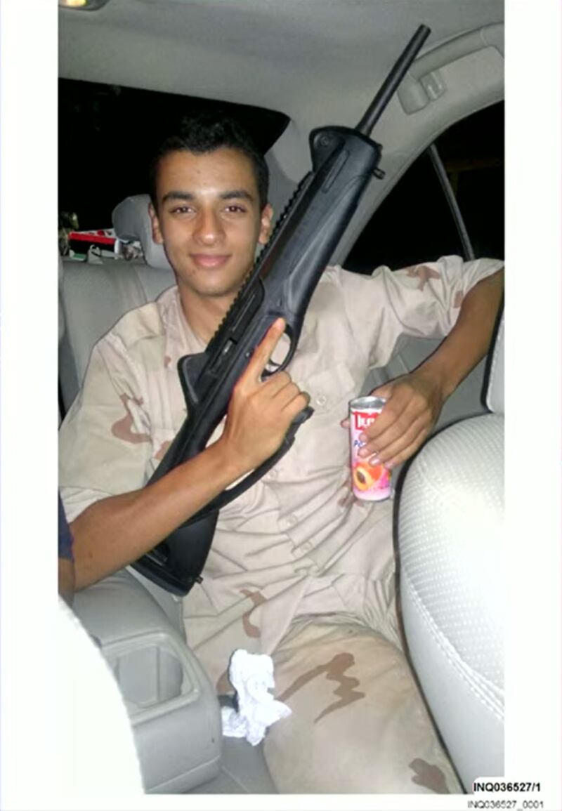 Ismail holding a gun.