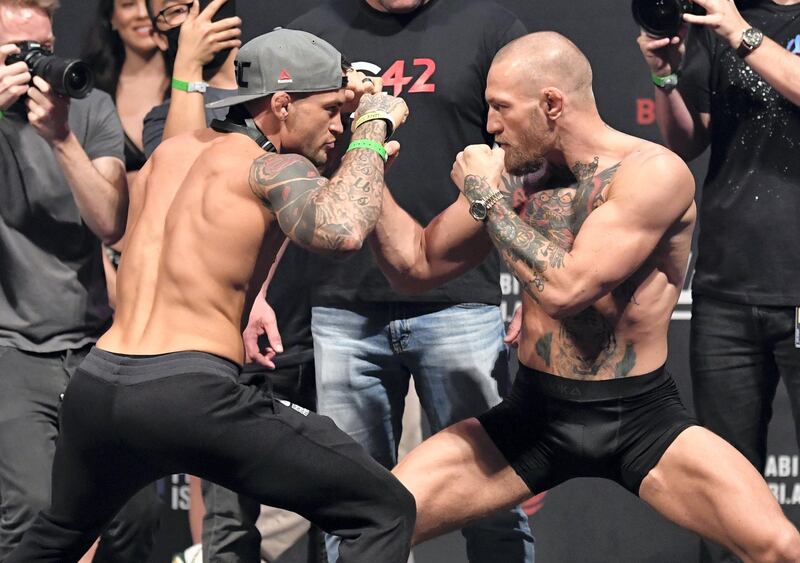ABU DHABI, UNITED ARAB EMIRATES - JANUARY 22: (L-R) Opponents Dustin Poirier and Conor McGregor of Ireland face off during the UFC 257 weigh-in at Etihad Arena on UFC Fight Island on January 22, 2021 in Abu Dhabi, United Arab Emirates. (Photo by Jeff Bottari/Zuffa LLC)