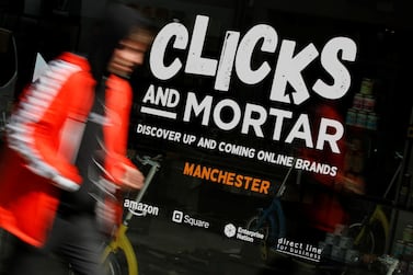 A man walks past the Amazon-backed pop up store 'Clicks and Mortar' in Manchester, Britain, June 3, 2019. REUTERS