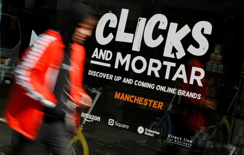 A man walks past the Amazon-backed pop up store 'Clicks and Mortar' in Manchester, Britain, June 3, 2019. REUTERS/Phil Noble