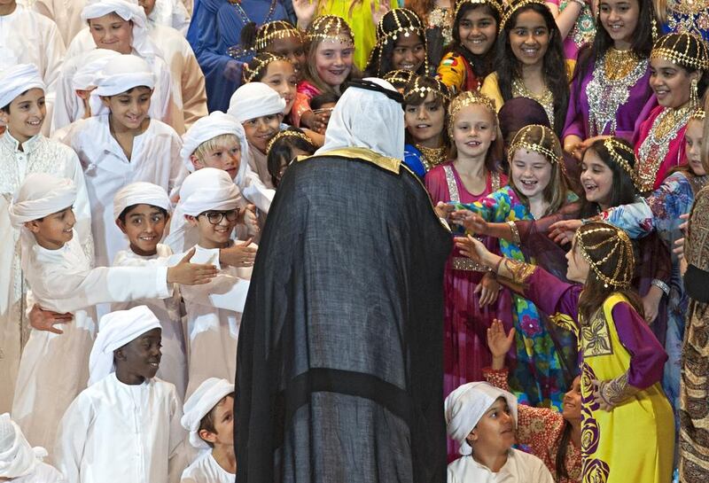 Members of the Combined Children's Choir reach out to shake the hand of Sheikh Nahyan bin Mubarak Al Nahyan, Minister of Culture, Youth and Community Development, at the opening ceremony of the sixth annual Emirates Airline Festival of Literature. Jeff Topping for The National