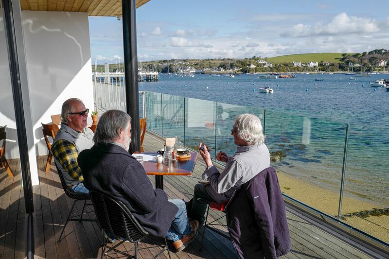 Diners enjoy an alfresco breakfast on the terrace at the Indidog brasserie, as outdoor hospitality restarts in Falmouth. Getty Images
